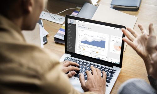 People working on a laptop in a meeting